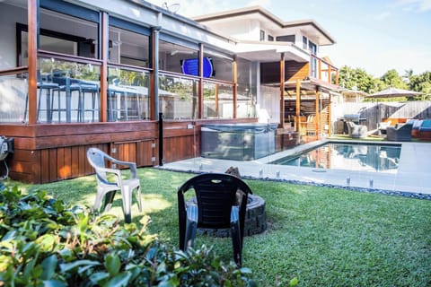 Full view of the backyard, fire pit and deck areas.