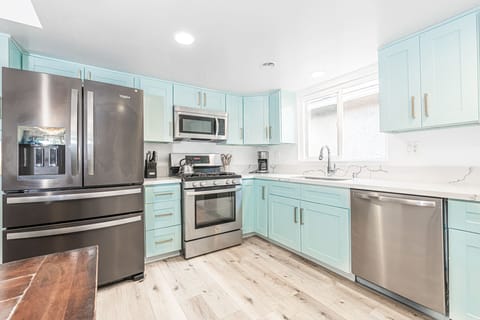 The kitchen comes stocked with dishes, utensils, cookware, bakeware, and small & large appliances.