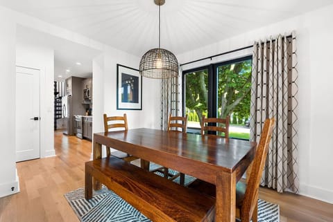 The dining table seats 6 strangers or 8 friends. Extra chairs in kitchen.