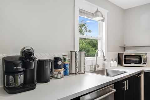 Coffee pot for grounds or k cups and hot water kettle for tea.