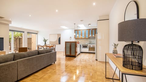 Open plan living, dining, kitchen leading out to north facing courtyard 