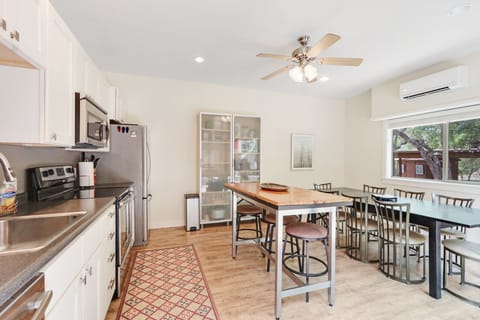 The shared kitchen features a full range/oven microwave, refrigerator and dishwasher.