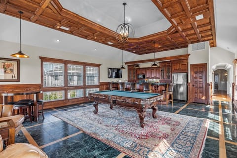Billiards Room - Full sized appliances, custom features and designs are sure to wow in this game lounge.