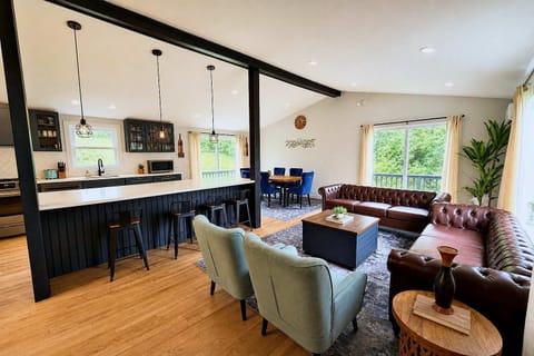 Open concept kitchen and living room with large island and fully stocked kitchen