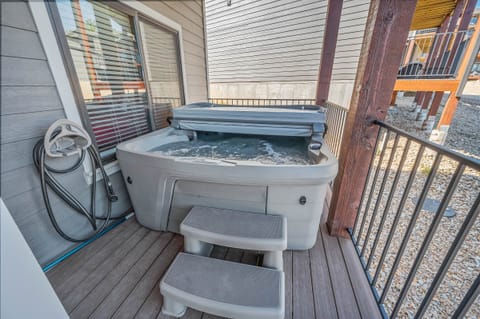 Private hot tub on the lower deck with a full size fridge for extra food and drinks