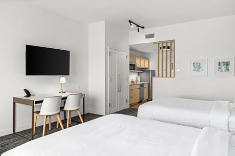 Premium bedding, laptop workspace, blackout drapes, iron/ironing board