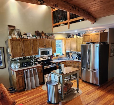 Kitchen equipped with all small appliances blender,  Crock Pot, toaster. 