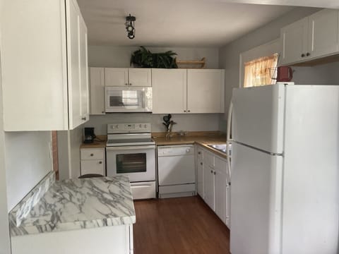 Kitchen stove, microwave, dishwasher & refrig.
