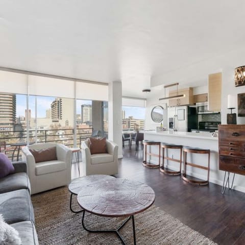 Spacious kitchen with a bar table and dining area, offering a beautiful view