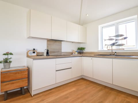 Fridge, electric kettle, toaster, cookware/dishes/utensils