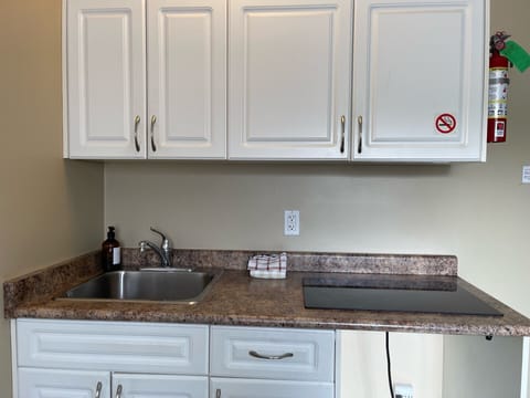 Standard Suite, 1 Bedroom | Living area | 32-inch TV with cable channels