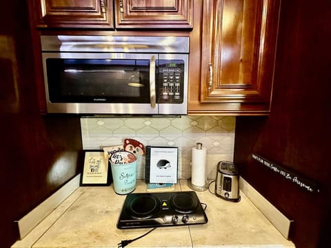 Microwave and two burner cook plate provided for cooking (No OVEN)