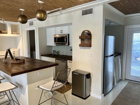 Fridge and coffee nook. Fully stocked kitchen. 