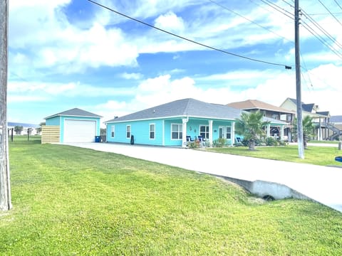 Home on corner with 2 drive entrance - additional drive added for more parking.