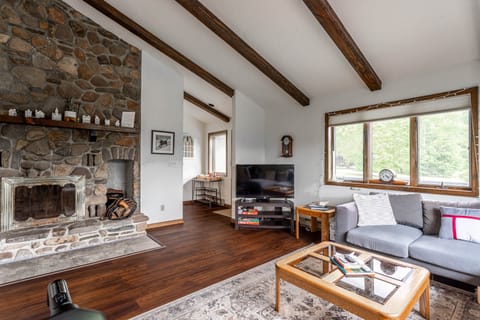 Living room with real log fireplace 