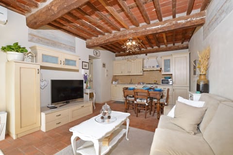 The living room with dining and kitchen