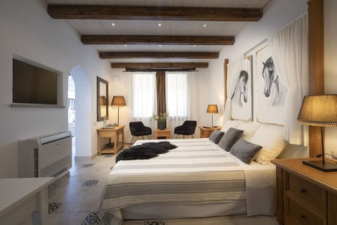 Family Room, 2 Bedrooms, Courtyard Area | Minibar, in-room safe, individually decorated, individually furnished