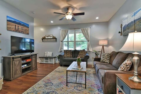 Living room with queen size sleeper sofa and flat screen TV for entertaining