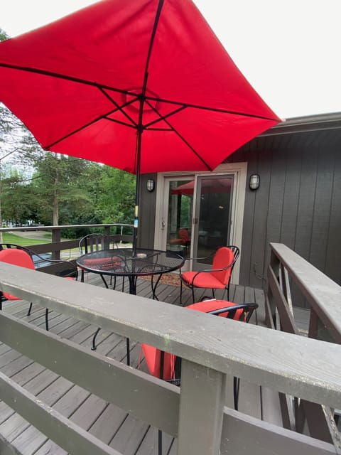 Outside seating area with table/chairs umbrella, gas grill available