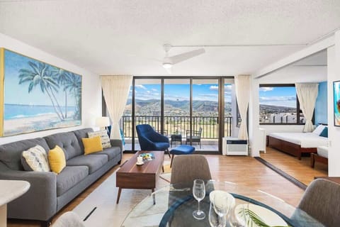 Relax and enjoy breathtaking mountain views from your pull-out sleeper sofa in this modern living space.