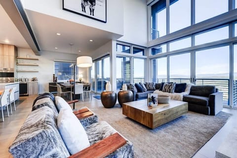 Great Room with massive windows looking out to the Uinta valley and mountains