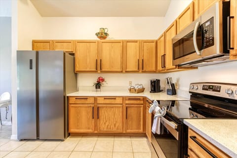 A classic kitchen recently updated with quartz counter top and new appliances.