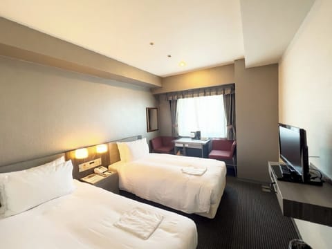 Economy Twin Room, Non Smoking | Down comforters, desk, blackout drapes, WiFi (free)