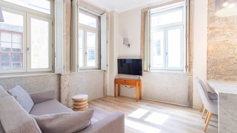Sunlight streams into the cozy living area, highlighting the historic stone walls and offering a comfortable spot to relax and unwind.
#LivingRoom #StoneWalls #LovelyStay