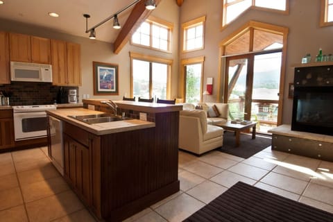 Get comfortable on the lovely sectional by the crackling fireplace