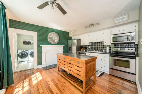 Laundry room is behind a door off the kitchen