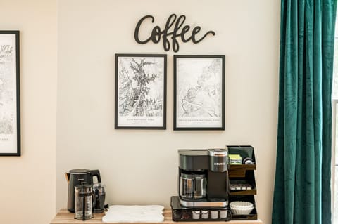 Coffee station w/ Keurig, regular coffee pot, grinder, milk frother, & K-cups.