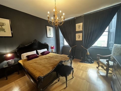 Master Bedroom with lush velvet curtains