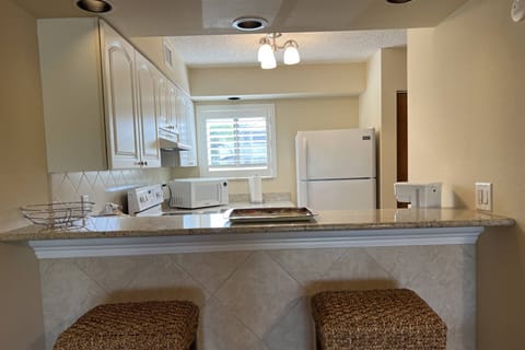 Kitchen area with beautiful granite counter tops!
