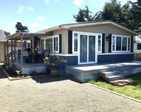Covered patio with bbq and patio off living room