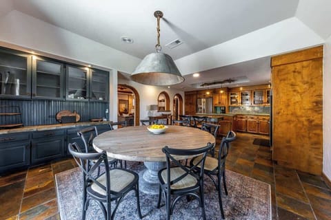 Large circular family dining table adjacent to the kitchen prep area so meals are a breeze and family engagement maximized.
| 9T Ranch by Boutiq Luxury Vacation Rentals | Gonzales, Texas