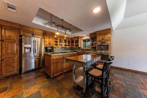 The kitchen is stocked with Made-In cookware and dining ware, has a double oven, microwave, french-door fridge, and an island stove.
| 9T Ranch by Boutiq Luxury Vacation Rentals | Gonzales, Texas