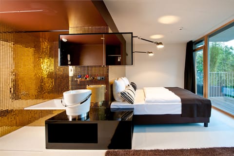 Designer toiletries, hair dryer, towels