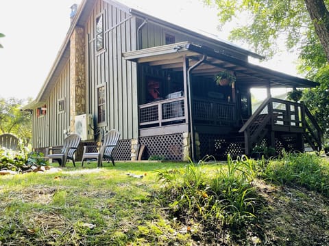 Side view of the cabin and  fire pit from the riverbank
