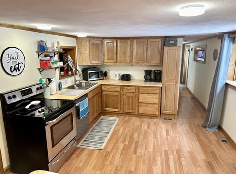 Kitchen with spice basket and common pantry.