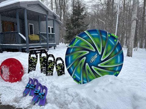 Enjoy some snow shoes and sleds provided in the garage.