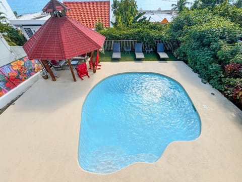 Outdoor area with pool and gazebo