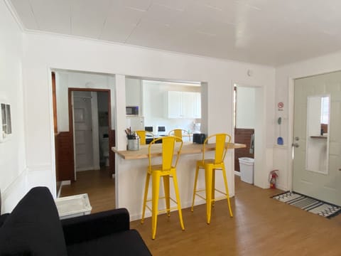 Countertop height dining chairs and bar area provide seating for 4.