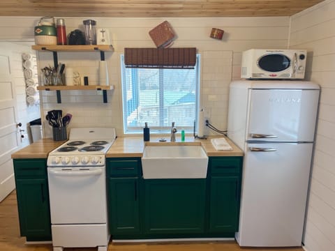 The kitchen is stocked with all the equipment you need for preparing meals.