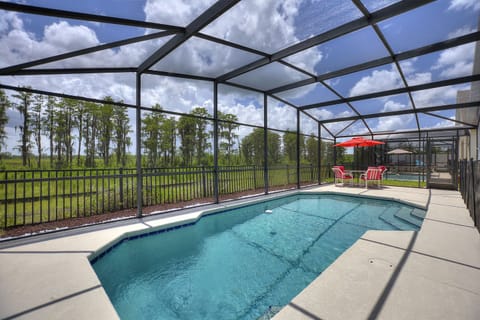 Swimming pool and fenced backyard 