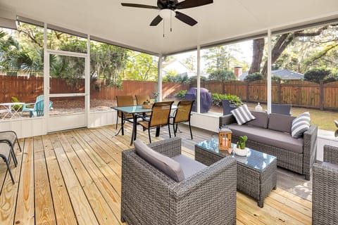 Newly constructed screened-in back patio  with fan, outdoor dining and lounge