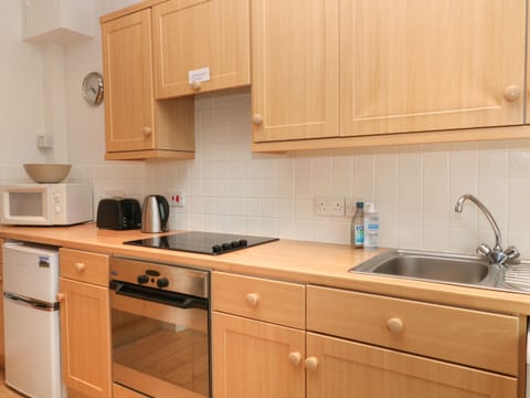 Fridge, electric kettle, toaster, cookware/dishes/utensils