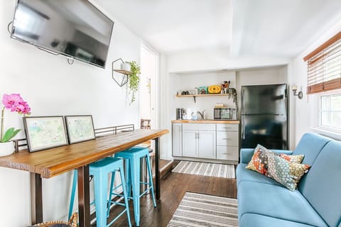 Cozy living space with kitchenette and work table