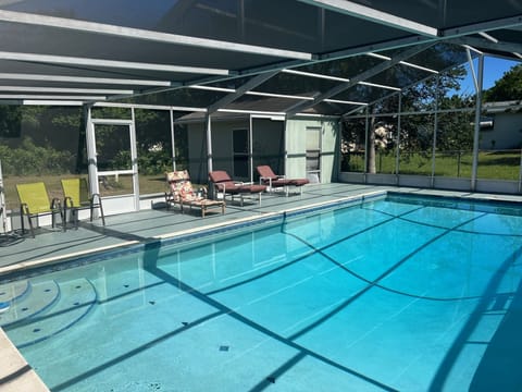 Huge Salt-Water Pool (3 ft - 8 ft) with relaxing lounge chairs.