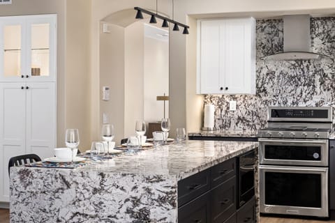 Beautiful open kitchen with stainless steel appliances.
