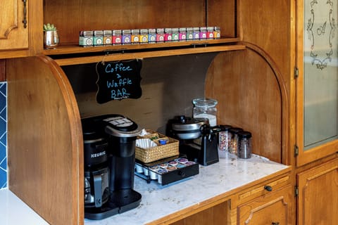 Fully stocked waffle and drip coffee and Keurig bar. 